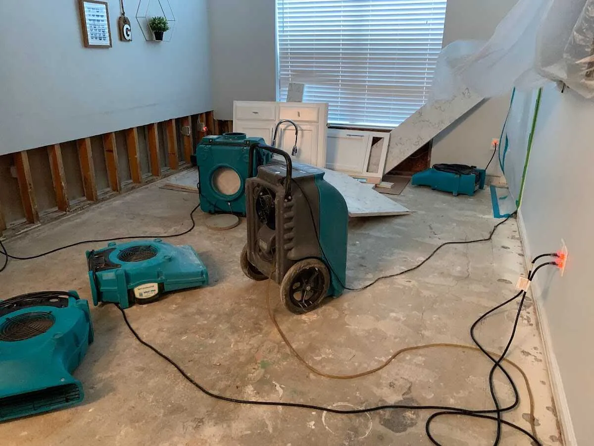 Dehumidifier in flood-cut room for Water Damage Restoration in Elsa